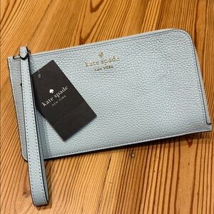 kate spade pale blue pebble leather wristlet with gold logo